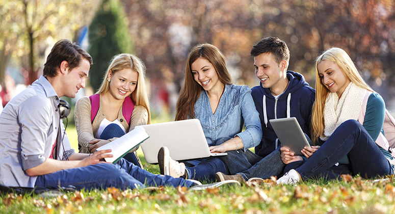 Group of college students studying at campus